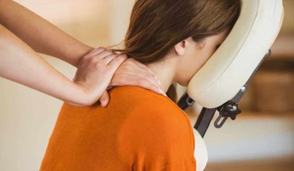young woman getting massage in chair in therapy ro 2025 04 03 05 02 30 utc