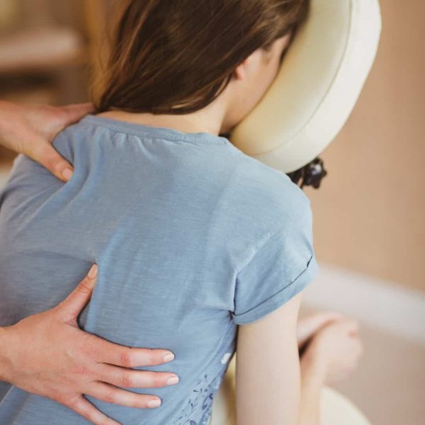 young woman getting massage in chair in therapy ro 2025 04 03 16 01 09 utc
